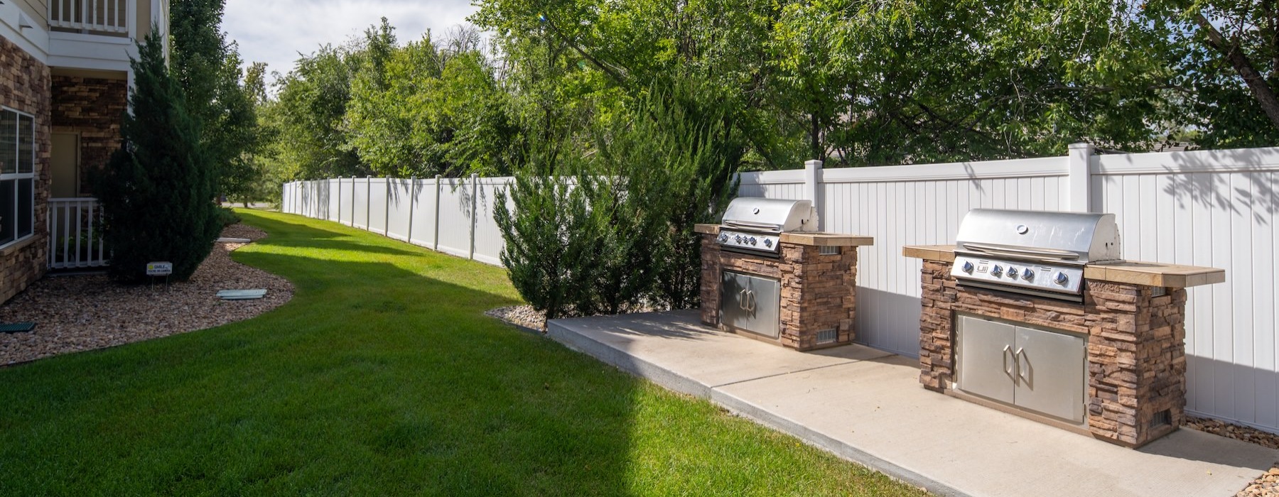 Grilling station and lush landscaping