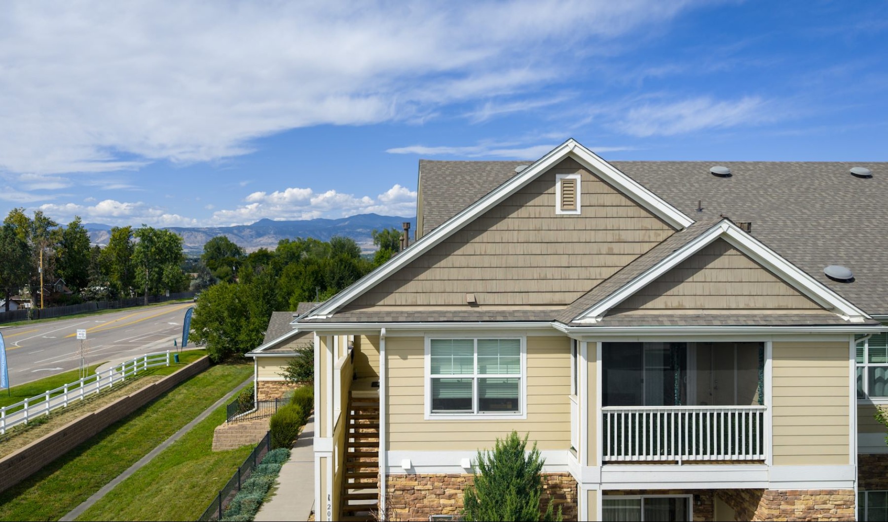 The essence of exceptional living a building with mountains in the background