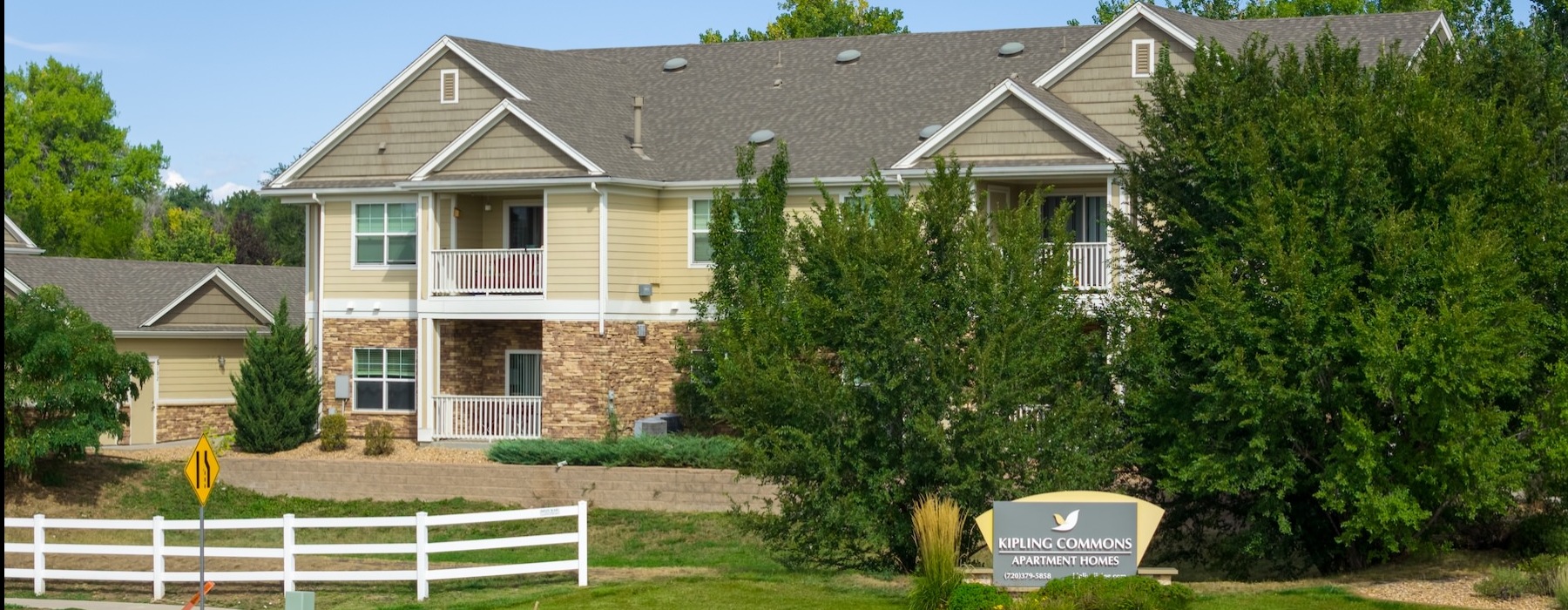 The essence of exceptional living the exterior of a building and a fence
